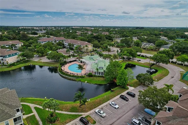 an aerial view of a house with a lake view