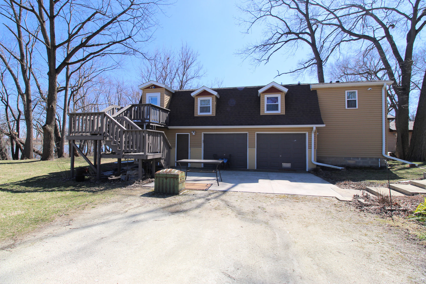 a view of a street with a bench in front of house