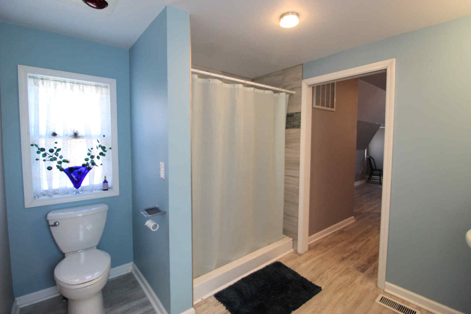 3435 South Riverview Court Kankakee, IL 60901 - Photo 9 of 16 a white toilet sitting next to a bathroom sink