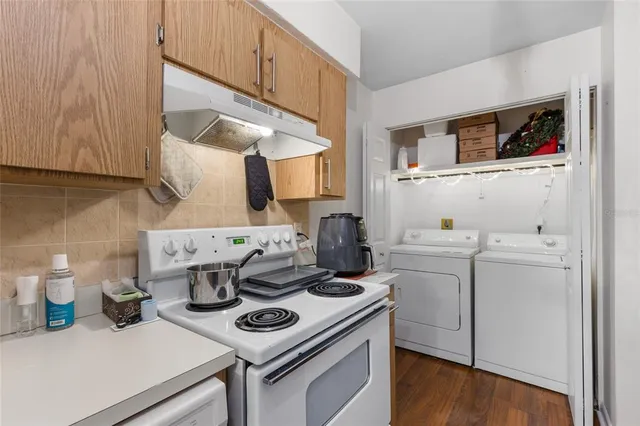 a kitchen with a stove and a microwave