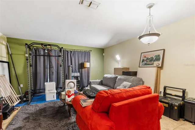 a bedroom with furniture and a window