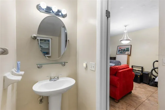 a bathroom with a sink and a mirror