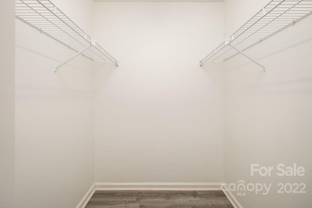 5003 Sharon Road, Unit C Charlotte, NC 28210 - Photo 20 of 27 a view of small space with empty racks on the wall