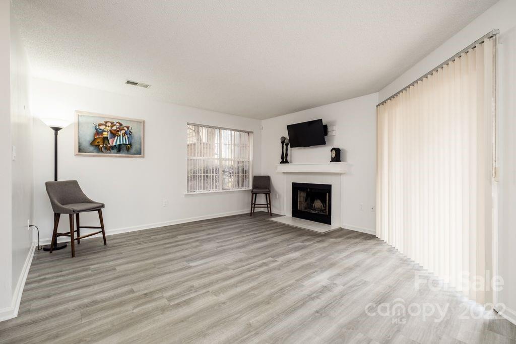 5003 Sharon Road, Unit C Charlotte, NC 28210 - Photo 5 of 27 a view of a livingroom with a fireplace and window