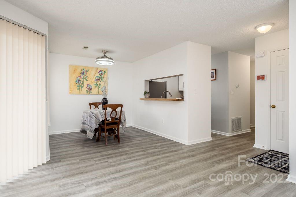 5003 Sharon Road, Unit C Charlotte, NC 28210 - Photo 7 of 27 a living room with furniture and a flat screen tv