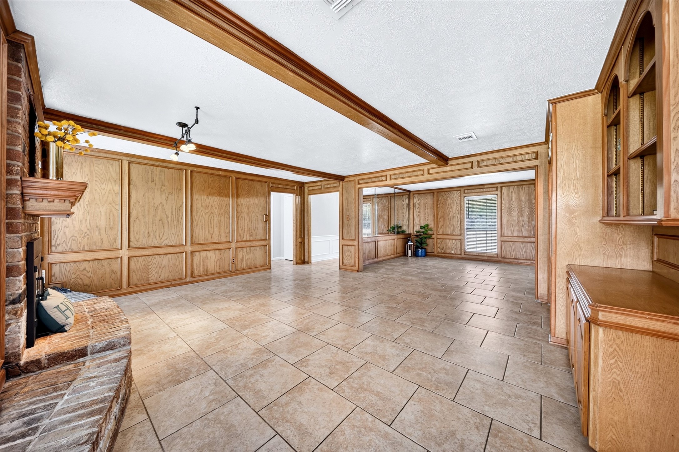 6507 Spring Leaf Drive Spring, TX 77379 - Photo 7 of 50 This angle showcases the true depth of this massive living space highlighting the wood paneling details and functional layout.