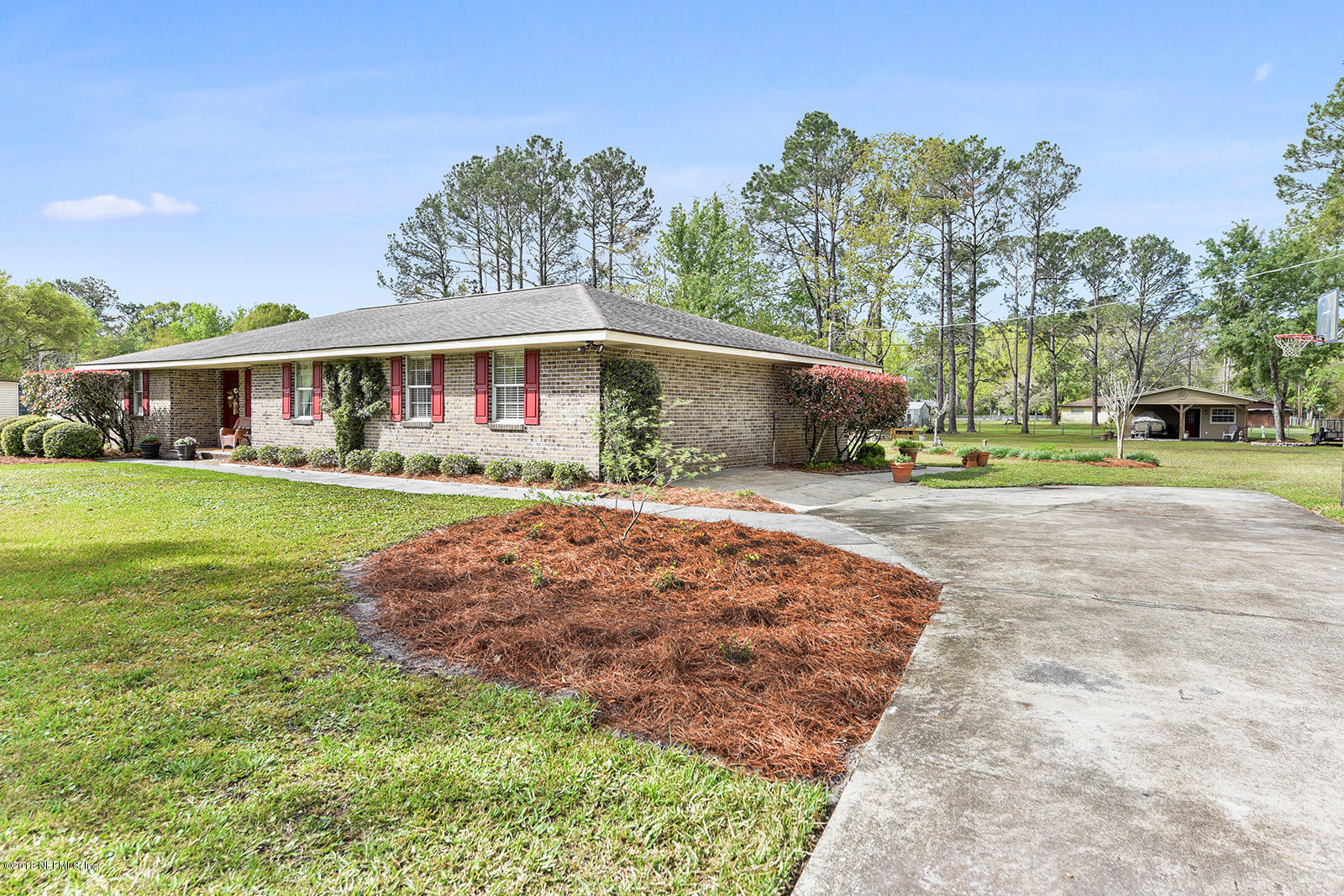54219 Marlee Road Callahan, FL 32011 - Photo 3 of 26 a front view of house with yard and green space