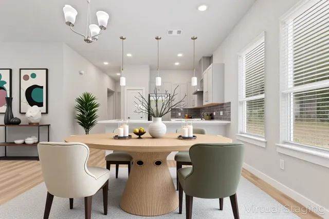a kitchen with a table chairs and a dining table