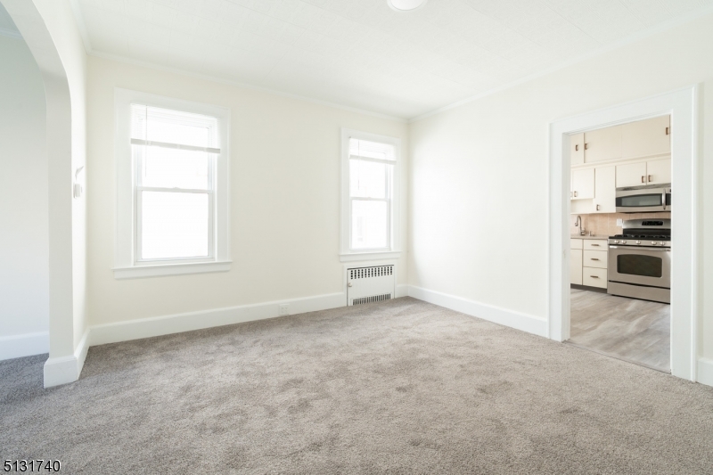 208 Tuscan Road, Unit 1 Maplewood, NJ 07040 - Photo 2 of 15 an empty room with windows