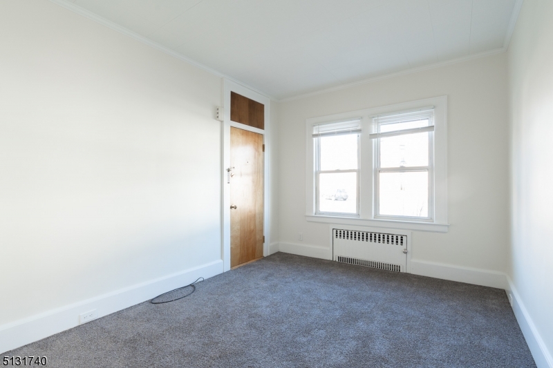 208 Tuscan Road, Unit 1 Maplewood, NJ 07040 - Photo 5 of 15 an empty room with a window