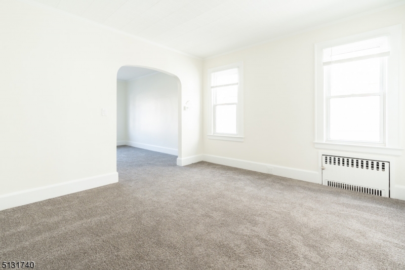 208 Tuscan Road, Unit 1 Maplewood, NJ 07040 - Photo 6 of 15 an empty room with a window