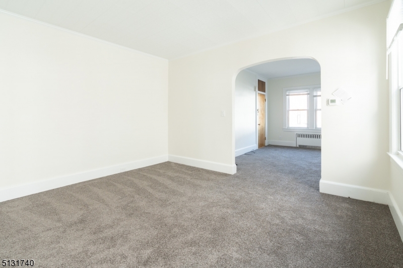 208 Tuscan Road, Unit 1 Maplewood, NJ 07040 - Photo 7 of 15 an empty room with a natural light