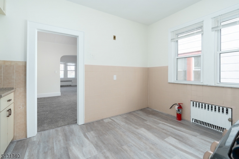 208 Tuscan Road, Unit 1 Maplewood, NJ 07040 - Photo 10 of 15 a view of a livingroom with wooden floor and entryway