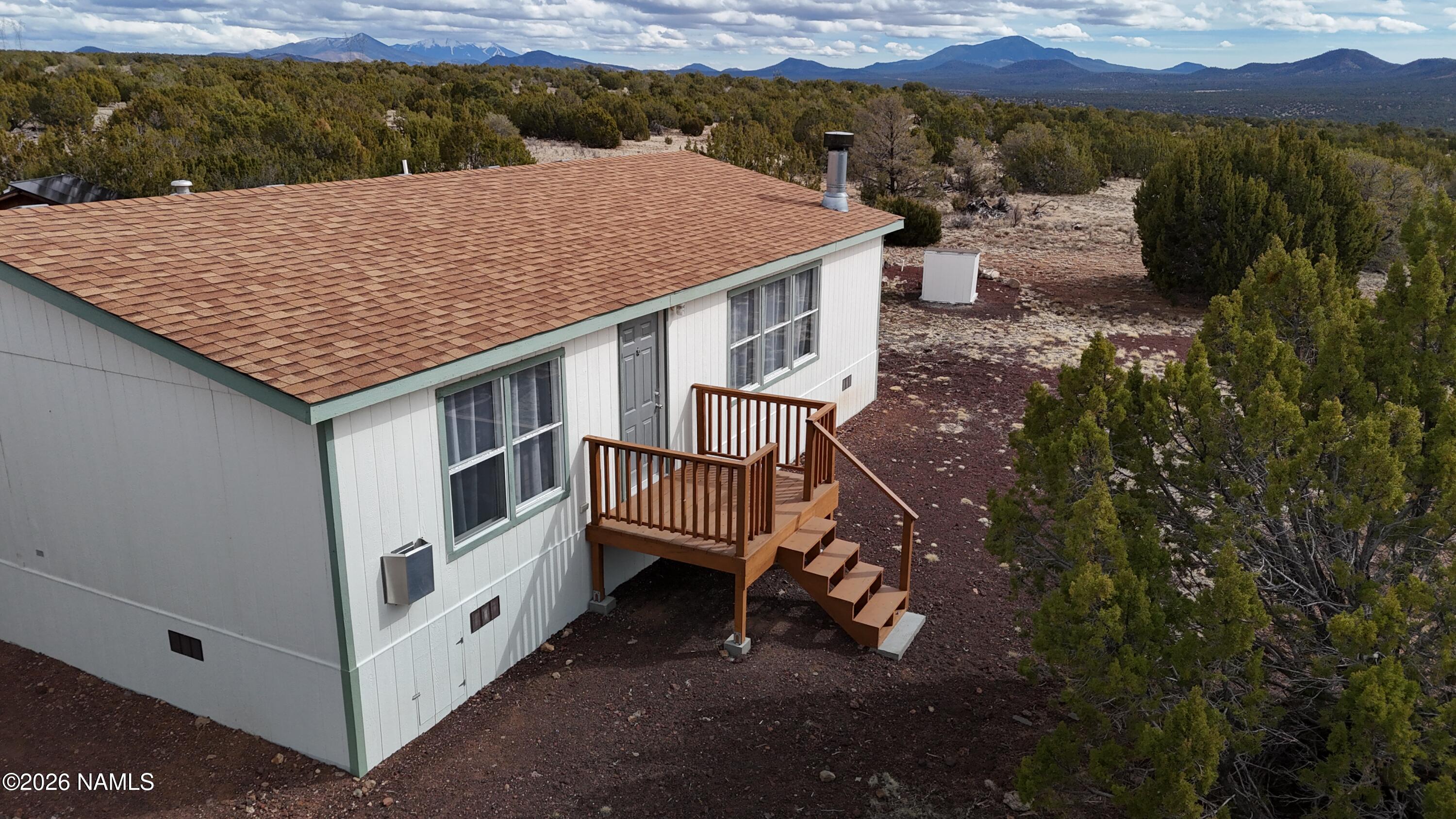 768 Mountain Cat Road Williams, AZ 86046 - Photo 28 of 37 a aerial view of a house with a yard