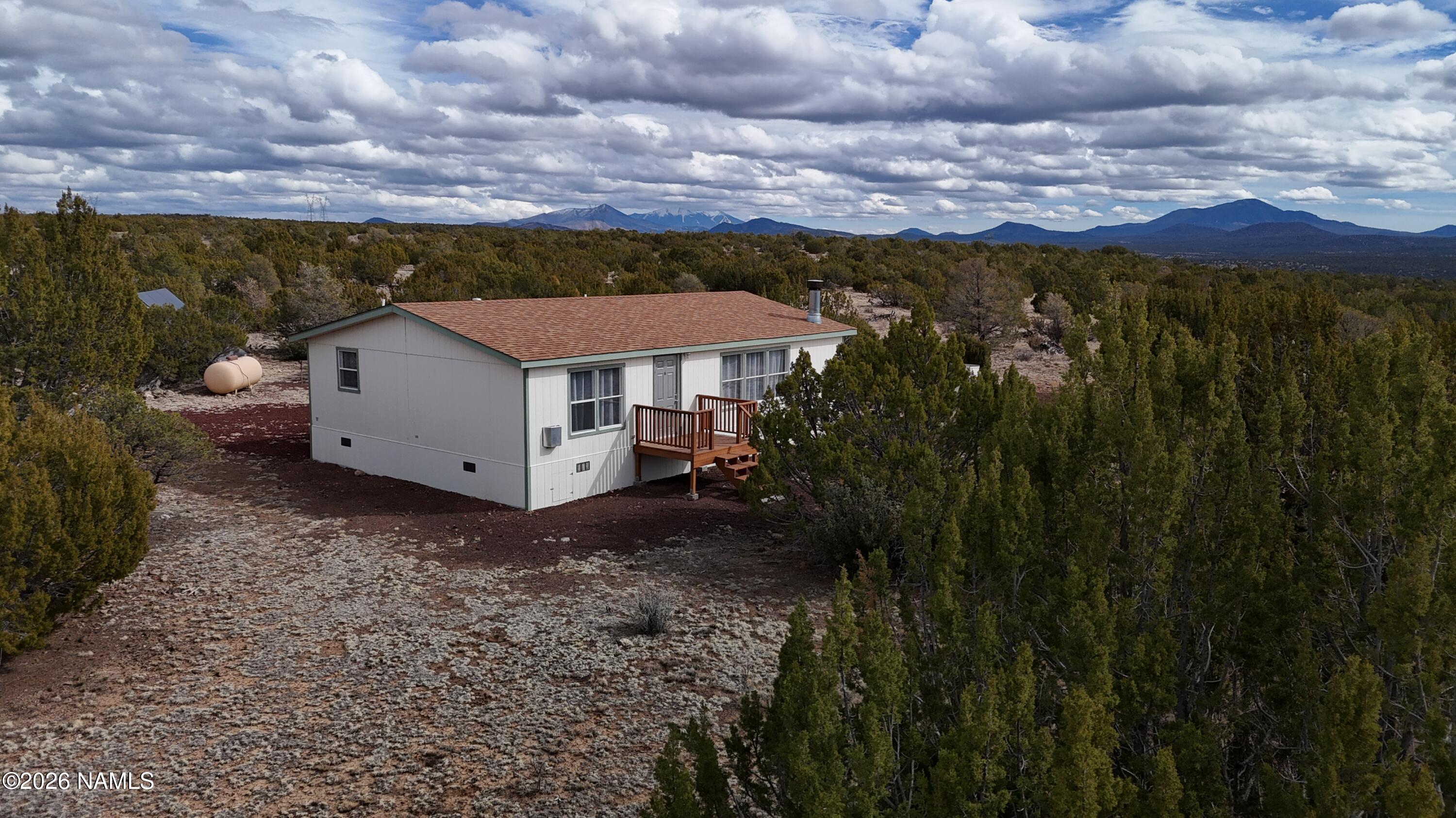 768 Mountain Cat Road Williams, AZ 86046 - Photo 29 of 37 a view of a house with a yard