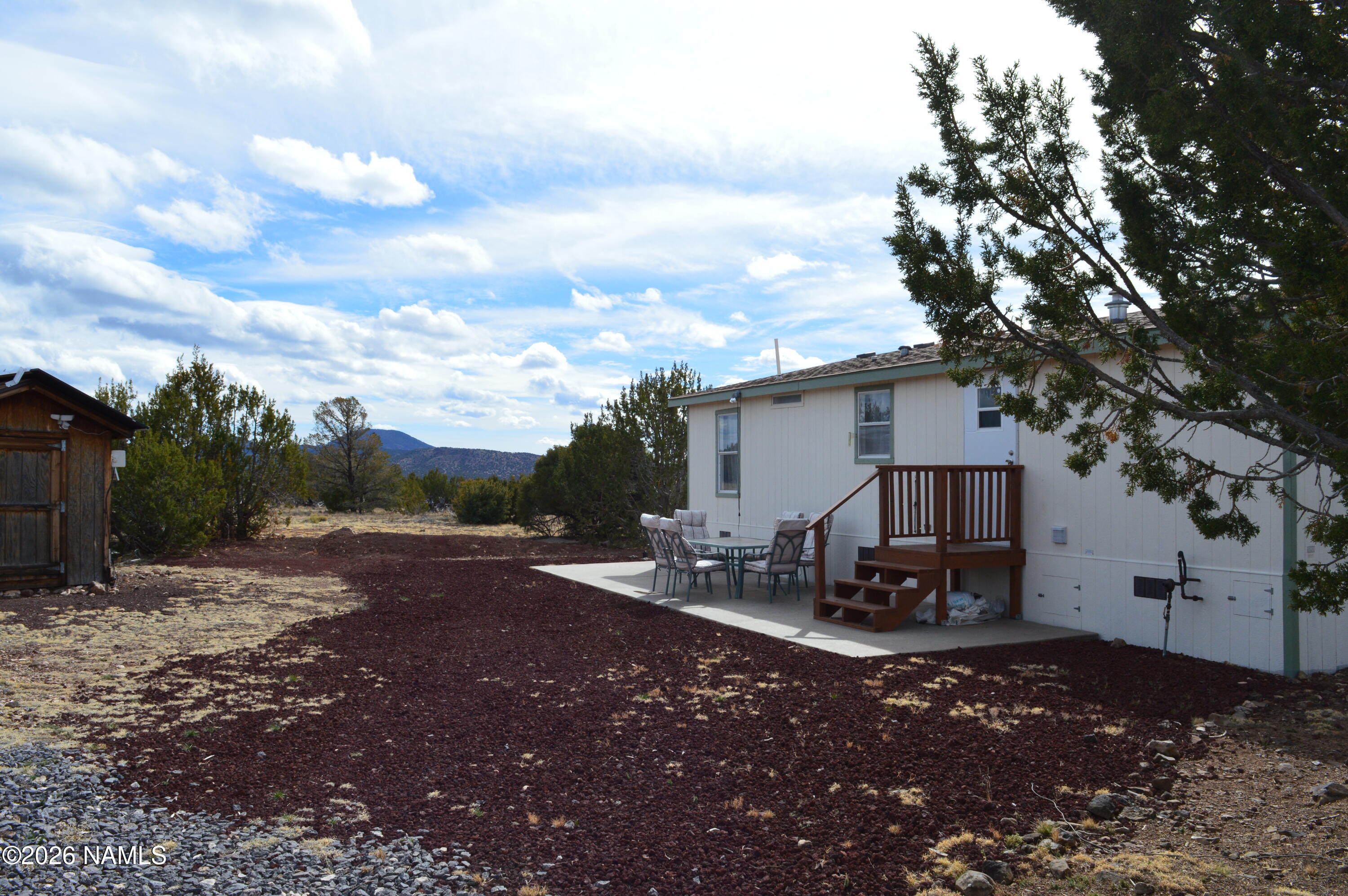 768 Mountain Cat Road Williams, AZ 86046 - Photo 31 of 37 a view of a house with backyard and sitting area