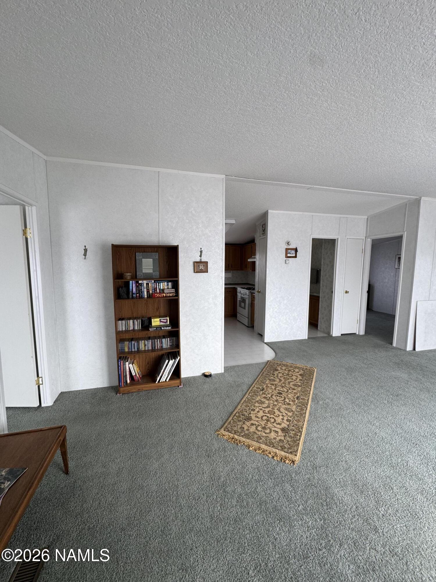 768 Mountain Cat Road Williams, AZ 86046 - Photo 9 of 37 a view of an empty room with closet and window