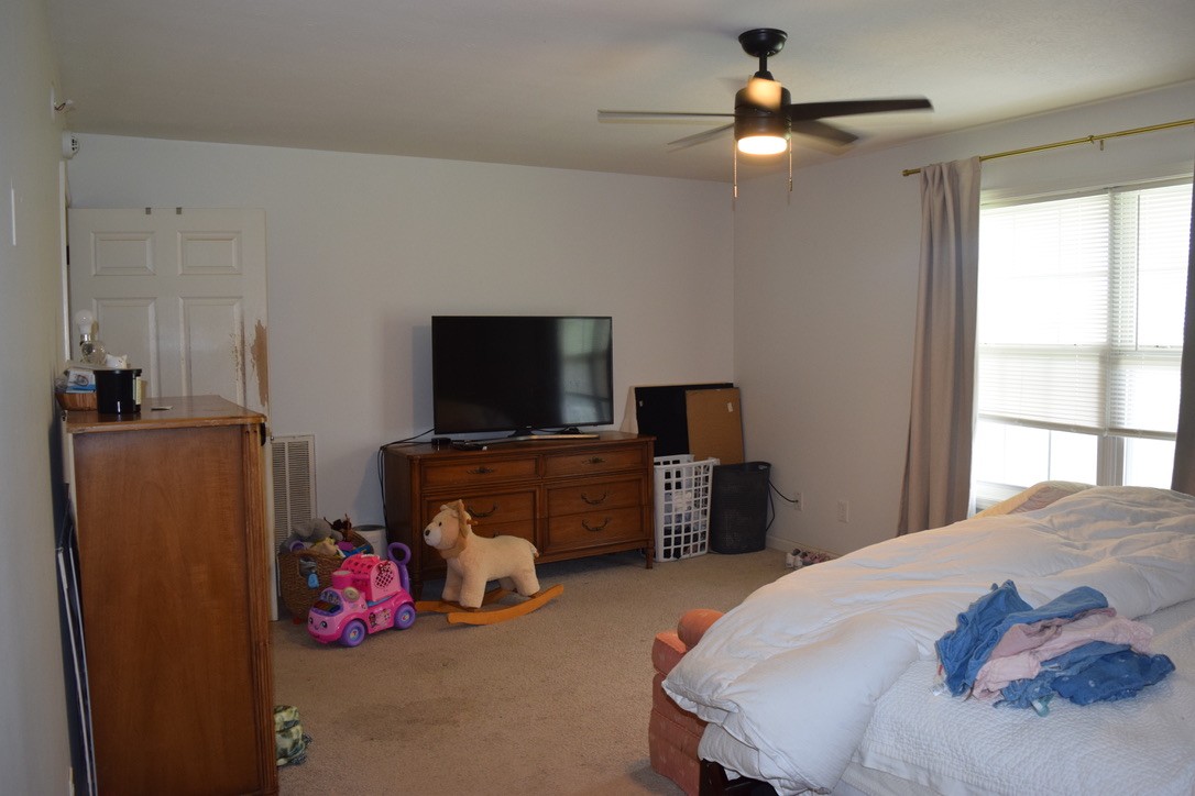 3516 Greens Mill Road Spring Hill, TN 37174 - Photo 12 of 17 a bedroom with a bed and a flat screen tv