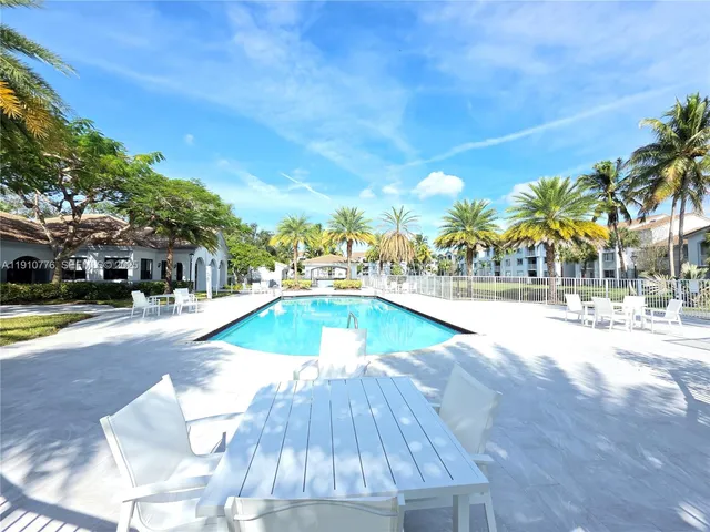a view of a swimming pool with a patio