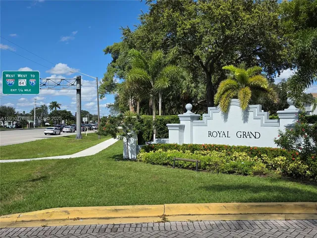 a view of a park that has a sign board