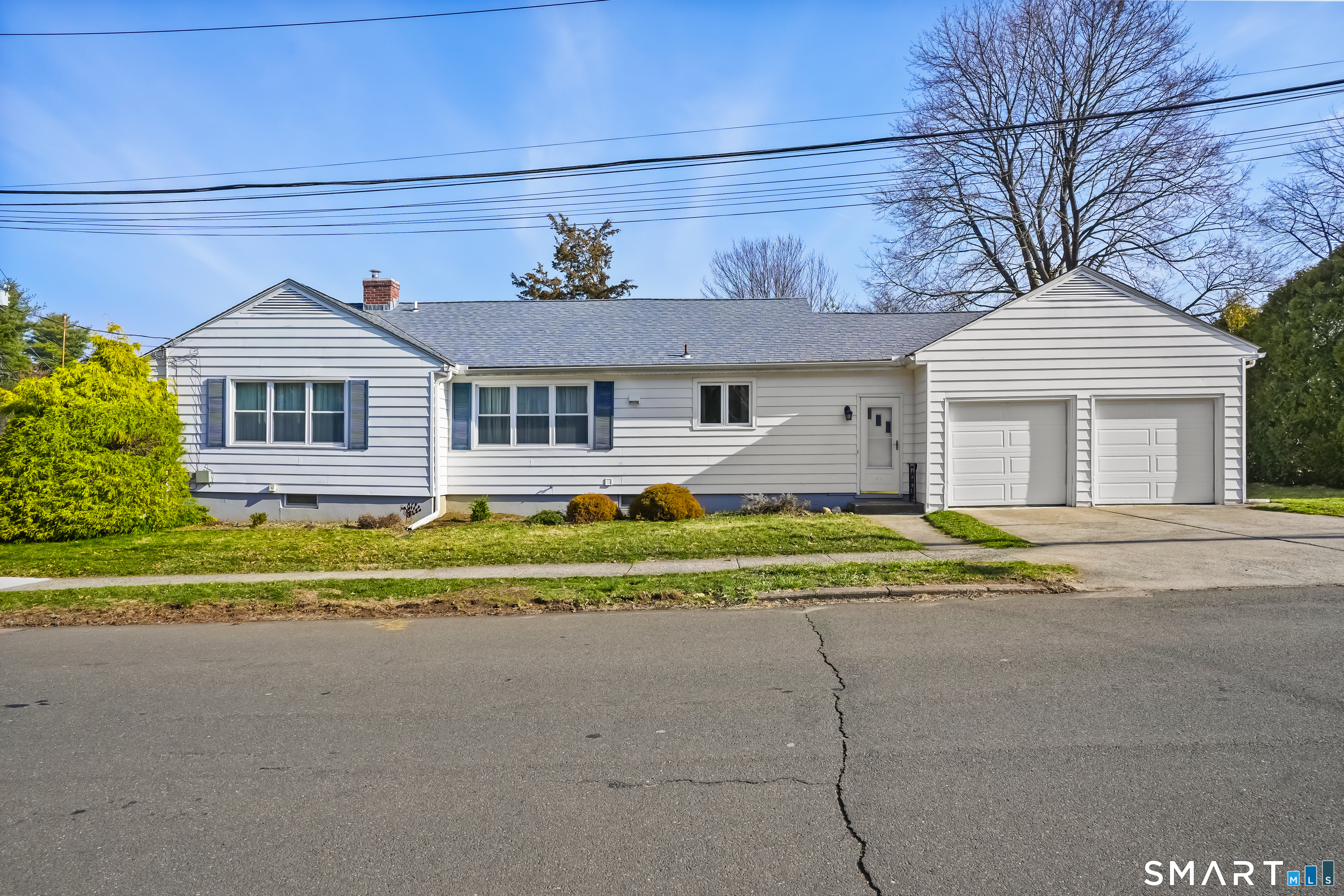 184 Greenway Street Hamden, CT 06517 - Photo 1 of 1 a front view of a house with a yard
