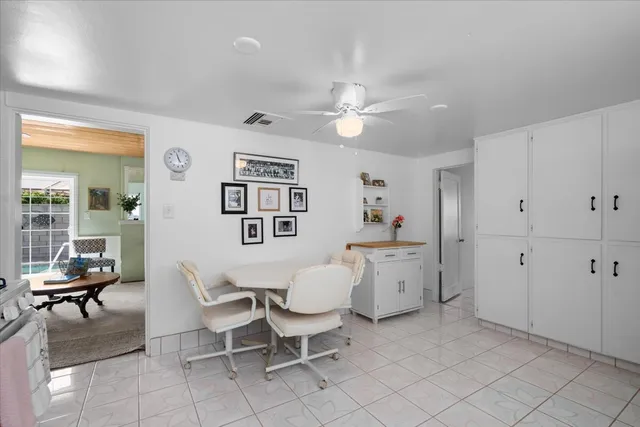 a view of a livingroom with furniture and a window