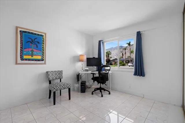 a work room with furniture and a window