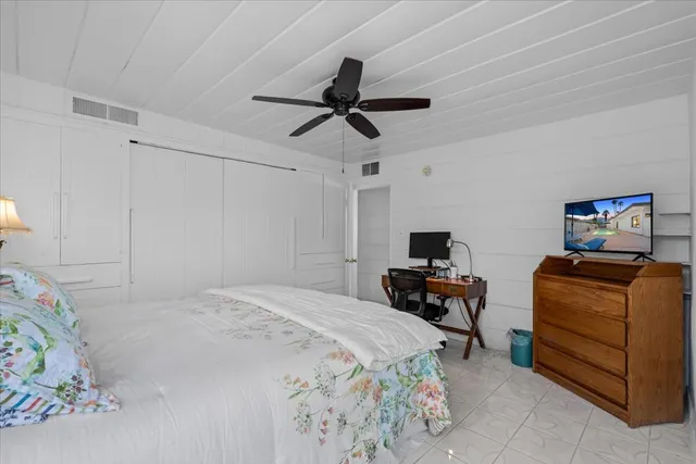 a bedroom with a bed and furniture