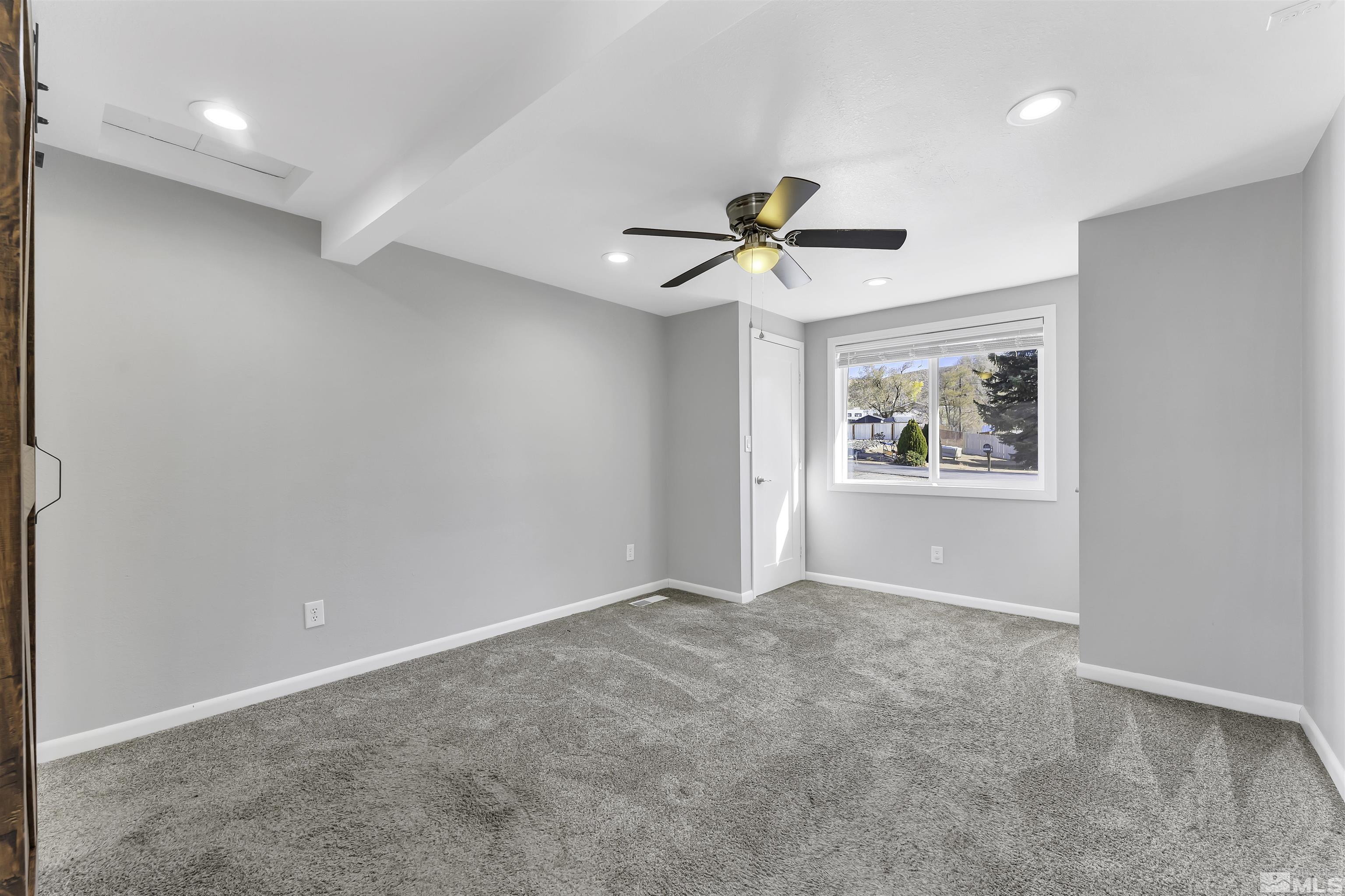 8625 Channel Way Reno, NV 89506 - Photo 13 of 29 wooden floor in an empty room with a window