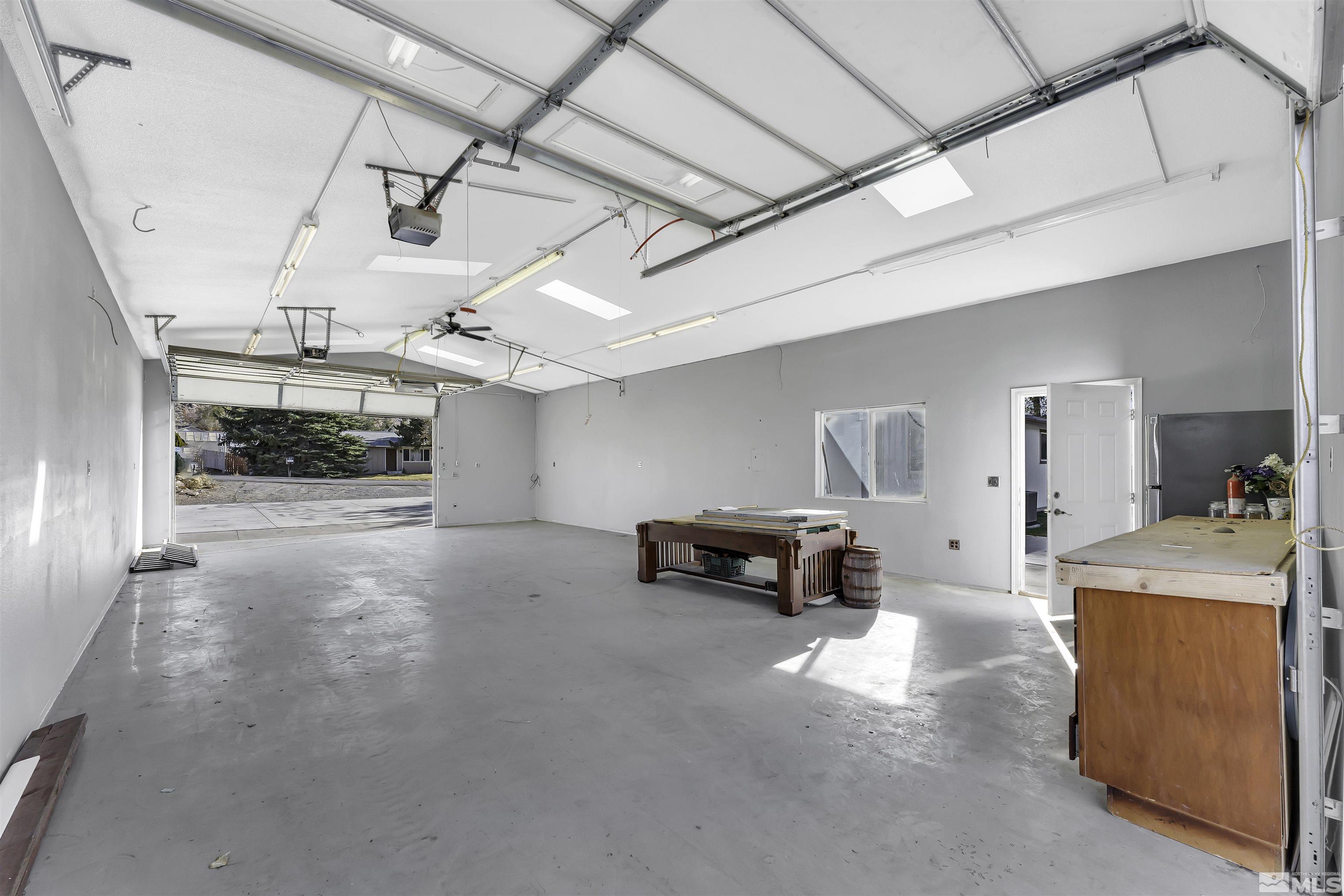 8625 Channel Way Reno, NV 89506 - Photo 22 of 29 a view of a livingroom with furniture and a garage