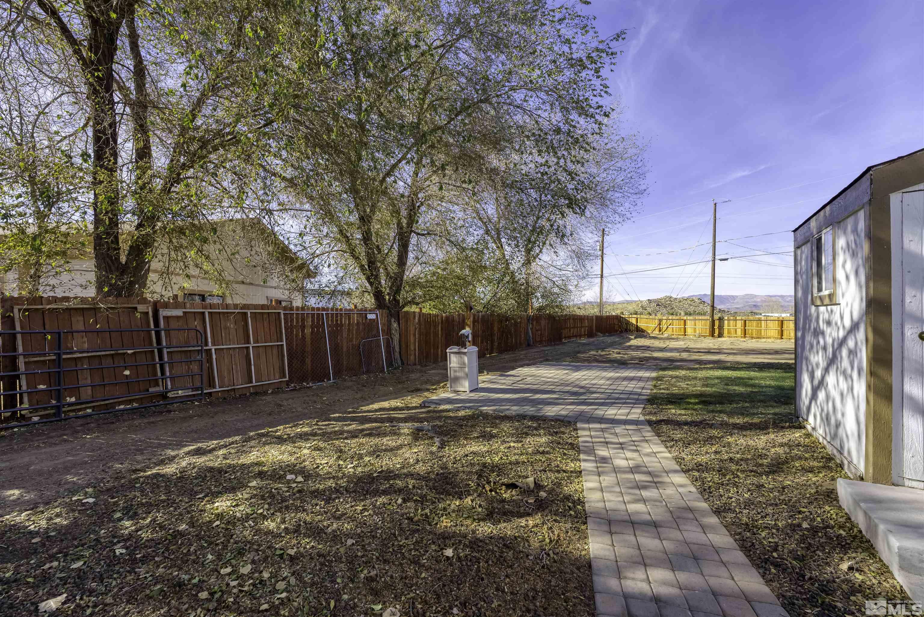 8625 Channel Way Reno, NV 89506 - Photo 26 of 29 a view of a yard with wooden fence