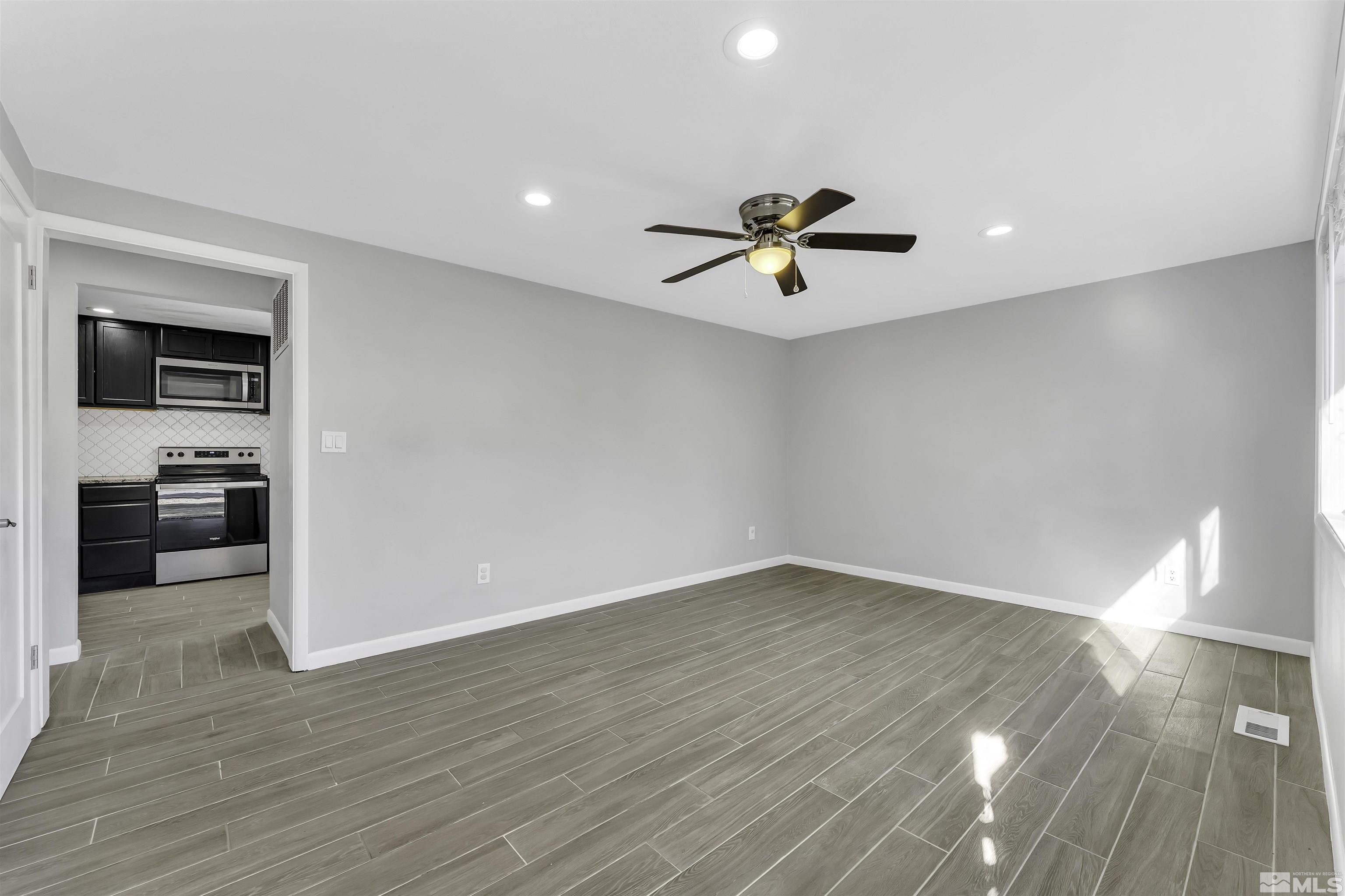 8625 Channel Way Reno, NV 89506 - Photo 4 of 29 a view of livingroom with hardwood floor and a ceiling fan