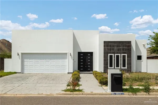 a front view of a house with a garage