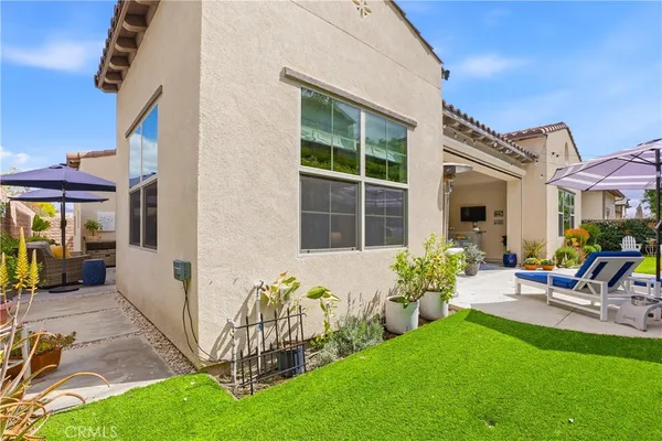a view of yard with fountain and large trees