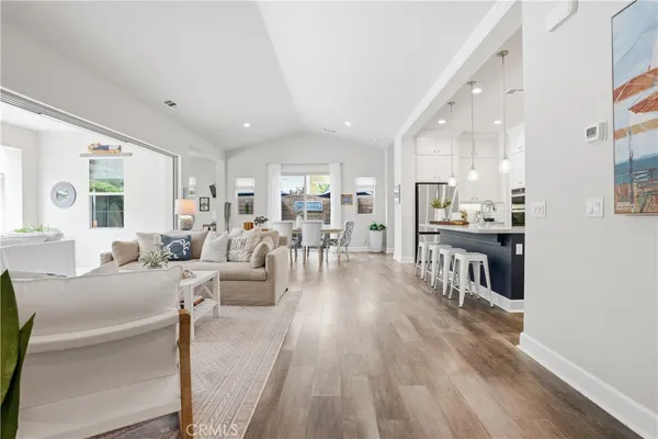 a bedroom with a bed flat screen tv and a window