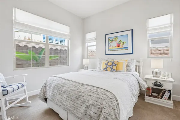 a room with wooden floor and white walls