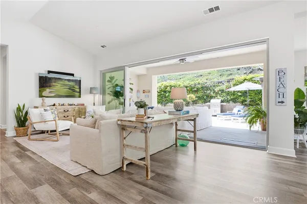 a living room with fireplace furniture and a flat screen tv