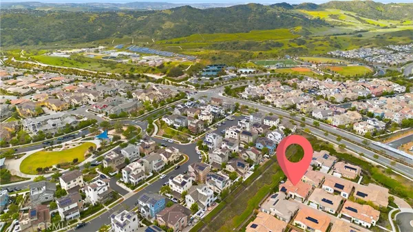 an aerial view of residential houses with outdoor space