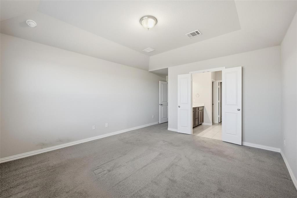 1116 Rountree Court Celina, TX 75009 - Photo 22 of 35 Primary Bedroom with ensuite bath