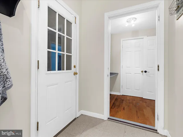 view of room with walk in closet and window