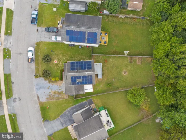 an aerial view of a house with swimming pool
