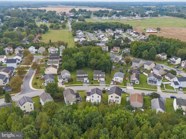 a aerial view of a house with a yard