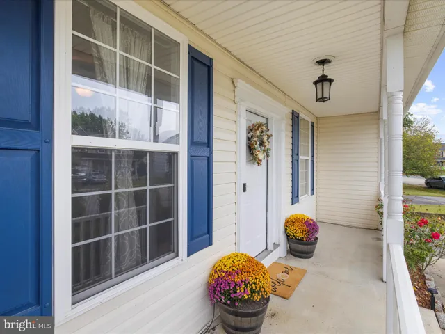 a view of a livingroom with furniture and front door