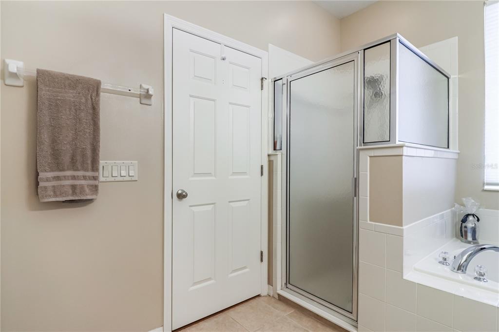27328 Pine Straw Road Leesburg, FL 34748 - Photo 16 of 32 a bathroom with a shower and a sink