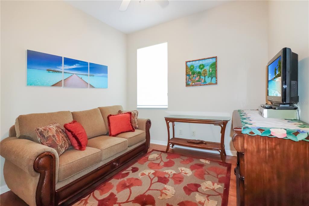 27328 Pine Straw Road Leesburg, FL 34748 - Photo 19 of 32 a living room with furniture and a couch