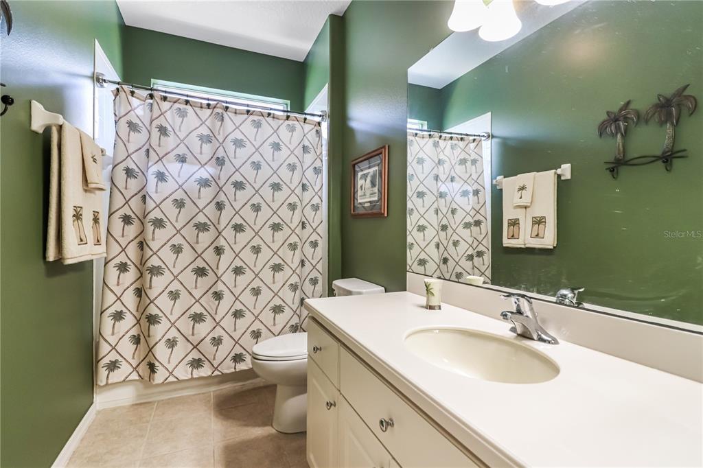 27328 Pine Straw Road Leesburg, FL 34748 - Photo 20 of 32 a bathroom with a sink and a mirror