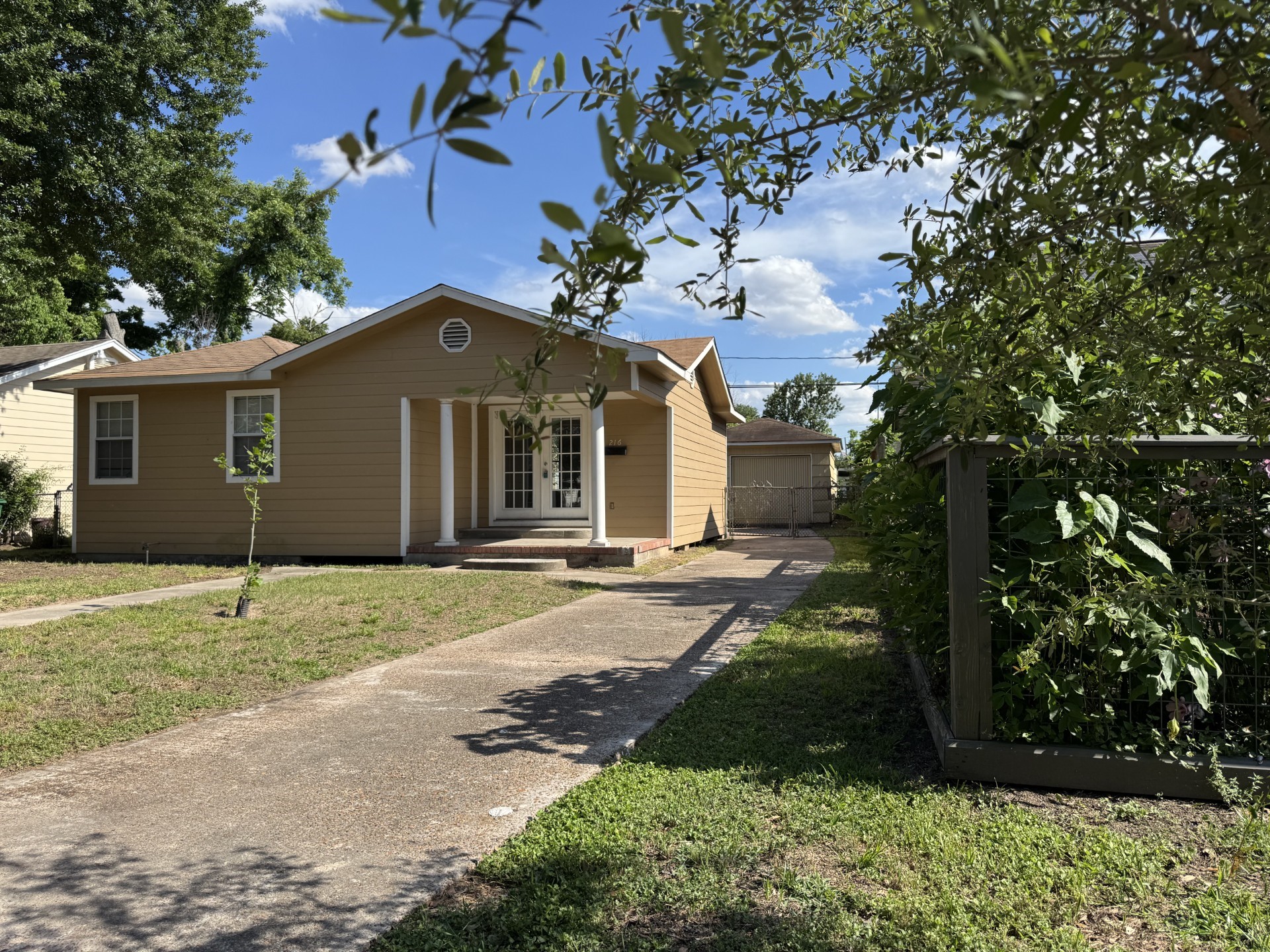 216 Gale Street Houston, TX 77009 - Photo 3 of 12 a front view of a house with a yard and garage
