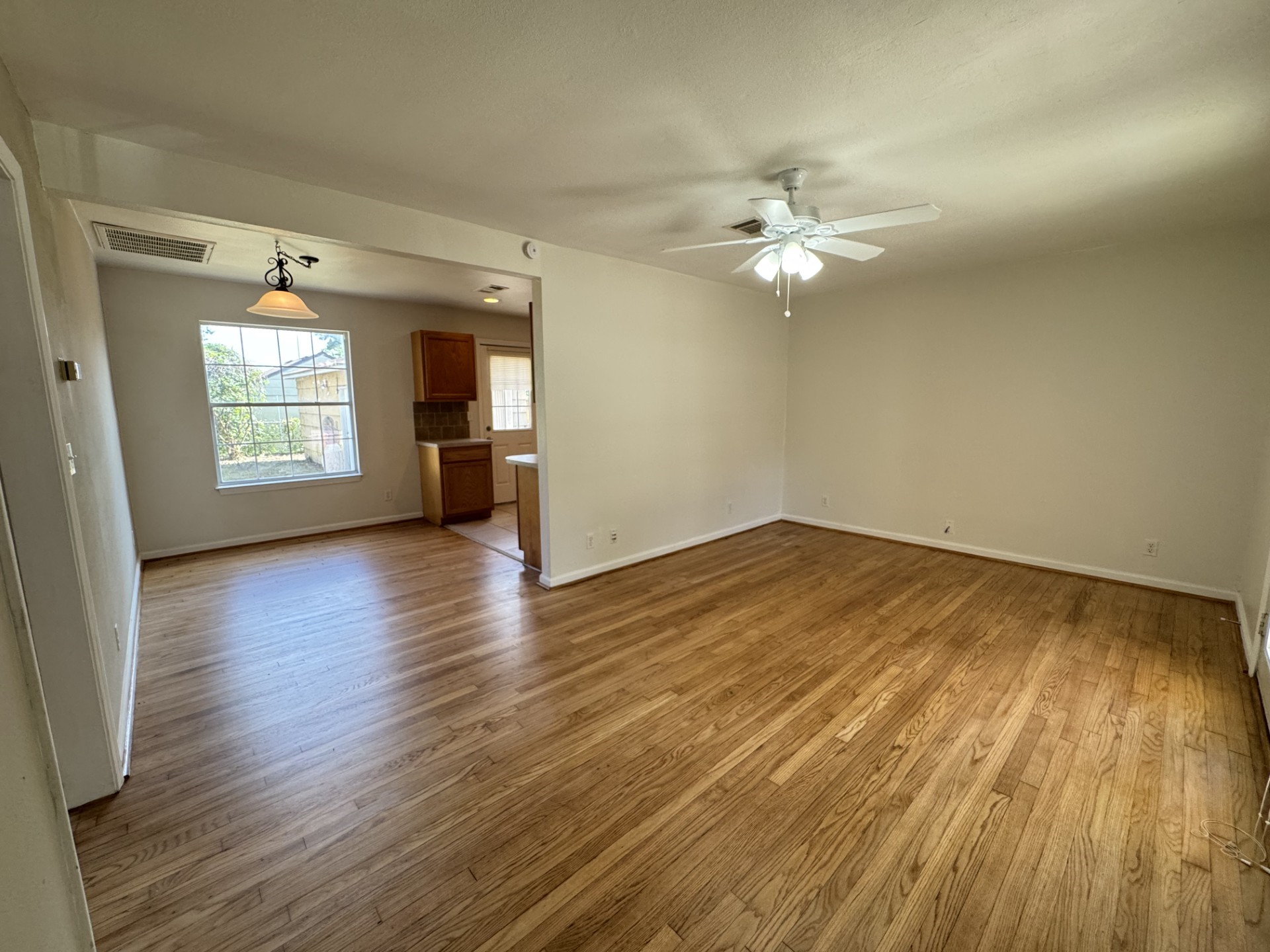 216 Gale Street Houston, TX 77009 - Photo 5 of 12 wooden floor in an empty room with a window