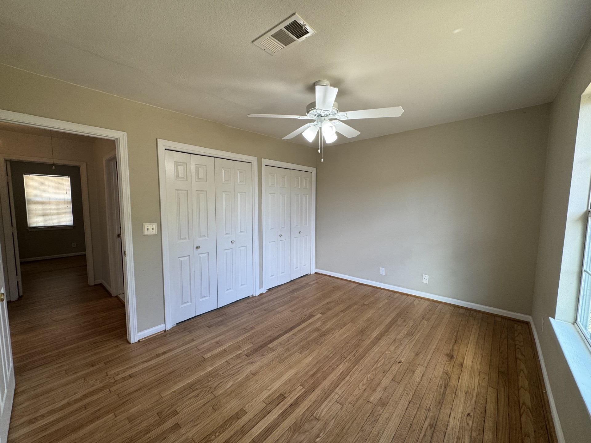 216 Gale Street Houston, TX 77009 - Photo 10 of 12 wooden floor in an empty room with a window