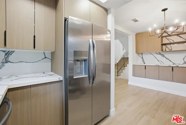 a kitchen with a sink and a stove